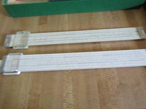 lot 144 image: Pickett slide rule in case Easer  co. slide rule rule with book of instructions
