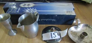 lot 154 image: Silver candlestick, creamer,  and spaghetti ladle and slotted spoon