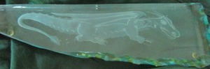 lot 172 image: Green glass dcor with dinosaur carving inside