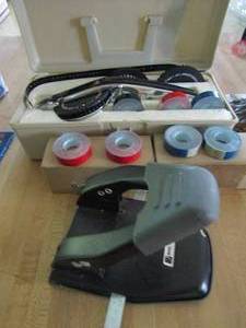 lot 180 image: 2 boxes of labeling tape, hole punch, pricing gun