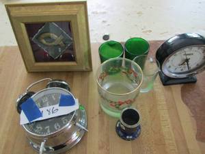 lot 186 image: 2 Westclox table clocks 3 glass candle holders shadow