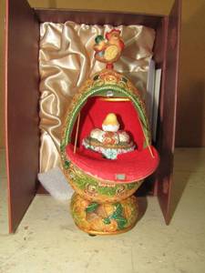 lot 198 image: G. DeBrekht artistic studios music box & rabbit egg that open to show hatching chicks
