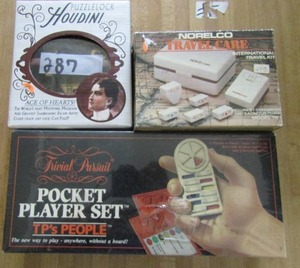 lot 287 image: Houdini puzzle lock NIB pocket player set NIB Norelco travel clock NIB