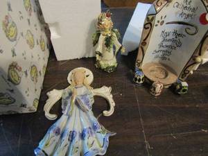 lot 309 image: Blue sky cathedral tea light 2003 angel white flower angel
