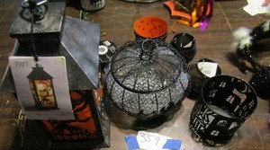 lot 359 image: Pier 1 lighted tea light house, metal Halloween basket, candles and spiders with bells
