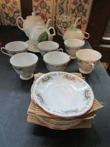 lot 373 image: 4 teapots and 6 matching china teacups & saucers