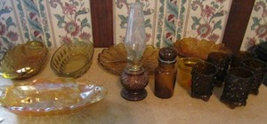 lot 378 image: Carnival glass oval bowl, yellow glass serving dishes, oil lamp and candle holder 13 pieces total