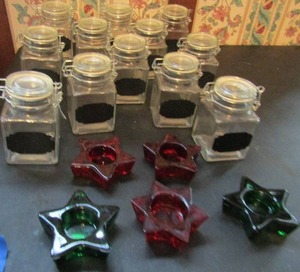 lot 379 image: 12 hinged glass jars with black chalk labels plus 5 star candle holders