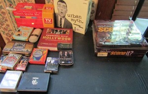 lot 442 image: Large game lot- Harry Potter scene it NIB, Harry Potter playing cards, Twilight cards, TV guide game and more.