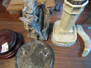 lot 454 image: misc. lot- 2 wood stands, marble candle holder, Gargoyle statue, light up light house and more