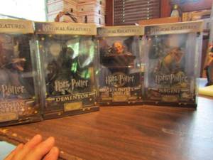 lot 545 image: Harry potter lot- The noble collection set of 4 figurines in boxes.