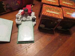 lot 555 image: Harry potter lot- notepad stand and extra pads plus hanging ornaments