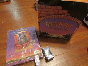 lot 556 image: Harry Potter lot lumos charm Hogwarts castle shower curtain,  and trivia game