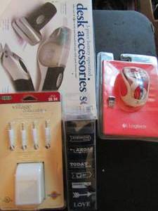 lot 618 image: Office lot- AC power adapter in package Logitech mouse, 7 piece stamp set, 3 piece battery operated desk set