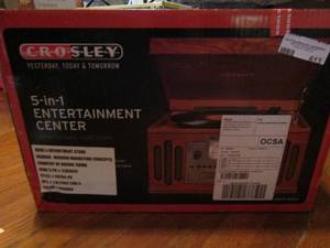 lot 613 image: 5 in 1 entertainment center in box Crosley 3 speed turntable, portable audio ready, CD player, AMFM radio stereo sound