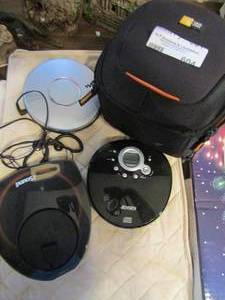 lot 604 image: case with 2 CD players, 2 headphones, and CD disc cleaner