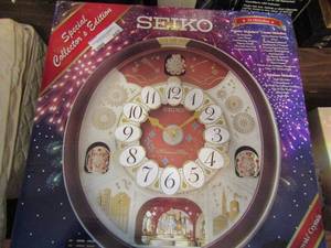 lot 607 image: Seiko Special Collector edition WALL CLOCK Melodies in Motion plays 24 melodies and features 16 Swarovski crystals battery operated UNOPENED