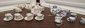 lot 643 image: Mini tea pot sets- Disney princess set includes teapot and cupssaucers 27 pieces total plus 2 other blue and floral sets
