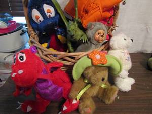 lot 653 image: Basket of dragon and bear stuffed animals