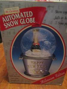 lot 671 image: NIB Mr. Christmas millennium edition auto snow globe
