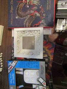 lot 708 image: Dragon lot- Pixar studio art kit, make your own paper dragons, picture frame and more