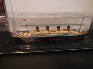 lot 730 image: Titanic ship in display case 2 glass sail boats in glass bottle on stand