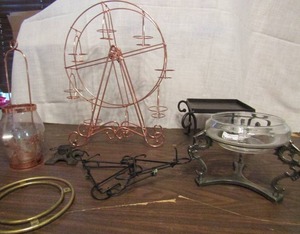 lot 748 image: Wheel of candle holders, metal stands pic stands