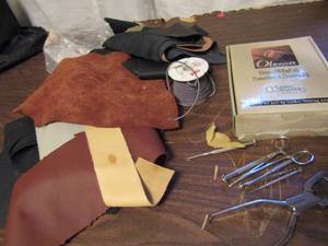 lot 795 image: Leather tools, lacing, and oil pull cleaning kit