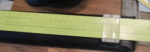 lot 880 image: Assorted USB adapters, screwdrivers, tire pressure check pickets slide rule