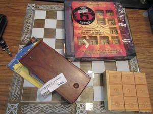 lot 881 image: Glass chess board, wooden puzzle tangoes and tic tack toe