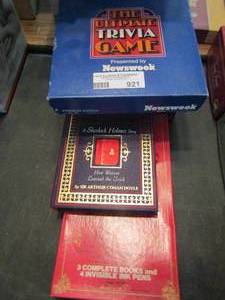 lot 921 image: 3 trivia games plus Sherlock Holmes mini book