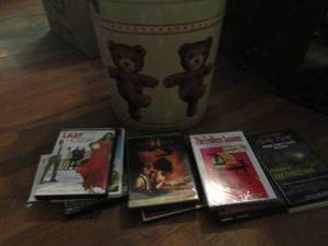 lot 996 image: Large bear tin 12x14 included 10 DVDs