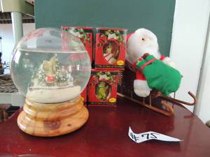 lot 75 image: 4 pocket dragon ornament, large christmas globe and santa in wicker sleigh