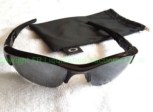 lot 57 image: Genuine Oakley sunglasses with Oakley storage bag