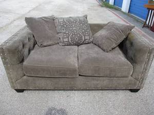 lot 78 image: Cindy Crawford Homes- Love Seat With Throw Pillows