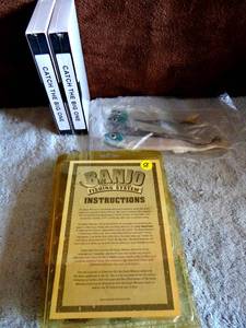lot 58 image: ORIGINAL VINTAGE BANJO LURE FISHING SYSTEM WITH SEALED VHS TAPES