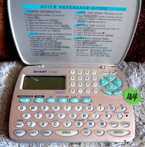 lot 104 image: SHARP EL-6900 English to Spanish Translator Personal Organizer Calculator