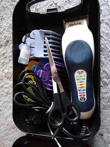lot 127 image: WAHL HAIR TRIMMER, SCISSORS, AND ASSORTED SIZE CLIPS IN STORAGE CASE