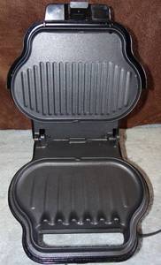 lot 185 image: George Foreman, Lean Mean Fat Grilling Machine- GR8BLK - TESTEDWORKS