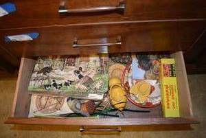 lot 56 image: Contents of Bottom 2 Drawers of Hutch Table Runner, Dominoes, Placemats and More