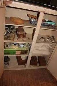 lot 477 image: Cabinet of paint supplies in Attic needs taken down