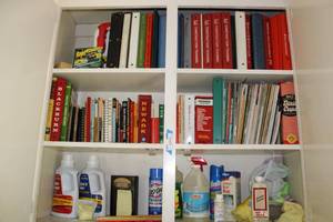 lot 215 image: Cleaning Items and Assorted Books