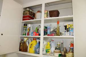 lot 218 image: Contents of Cabinet Cleaners, Light Bulbs, Tins and Tape