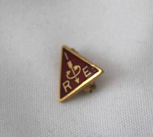 lot 501 image: 14K yellow gold RE Engineering enamel lapel pin. Marked 14K