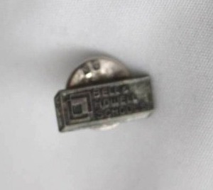 lot 503 image: Sterling Silver Bell & Howell Schools lapel pin. Marked Sterling