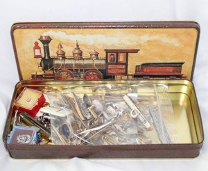 lot 505 image: Gentlemans Drawer Lot. Tie Bars, Cufflinks, tokens, tie tacks and more. Includes a tie bar and cufflinks.