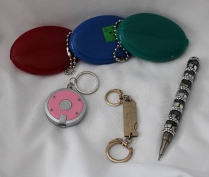 lot 507 image: Keychain assortment w decorated pen. One keychain from the Park Hotel, Kansas