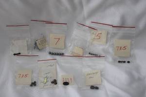 lot 514 image: Gemstone beads and facetedrough gemstones in individual packages. Includes Garnets, Black Onyx, Tiger Eye, Synthetic Blue Zircon, cultured pearls, Plus