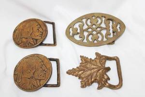 lot 516 image: (4) Brass belt buckles - Includes (2) Indian Head, (1) Maple Leaf Plus (Bid is times the money)