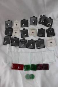 lot 519 image: Lindenworlds cubic zirconia in original packaging. Made in USA (Bid is times the money). Includes (13) clear of varying sizes - some are matched pairs for earrings and (5) colored). Also includes faceted and cabochon glass pieces